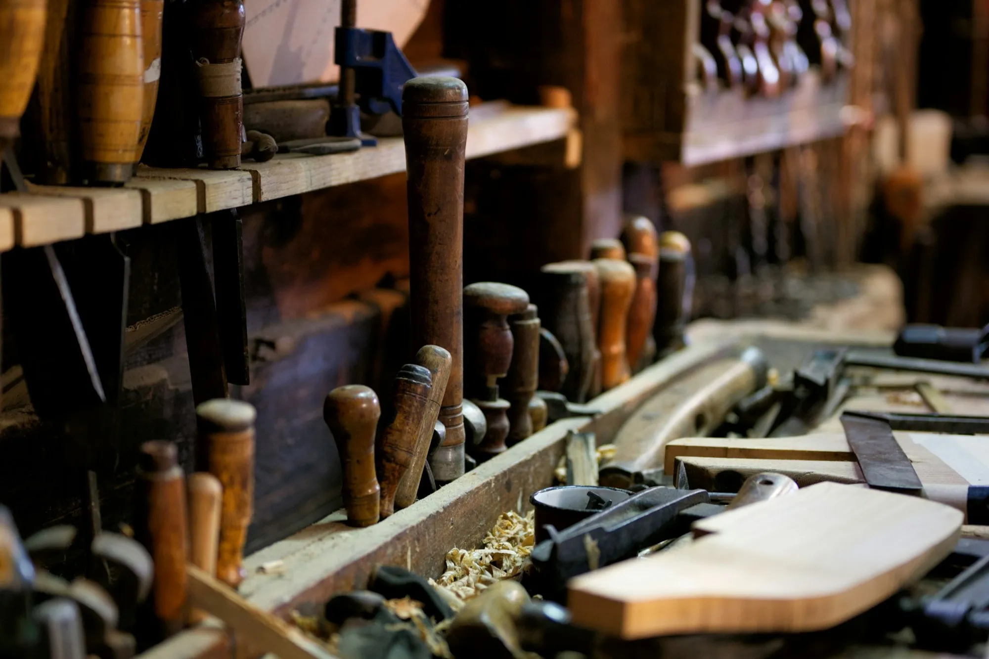 A workbench full of tools in a woodworking shop